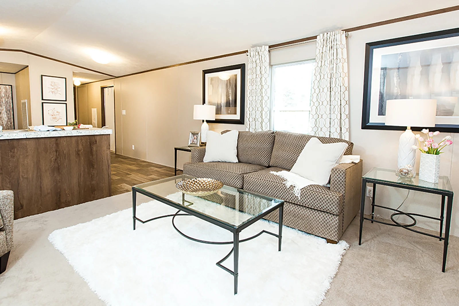 Bright open-plan living room inside a two-bedroom park model home on wheels