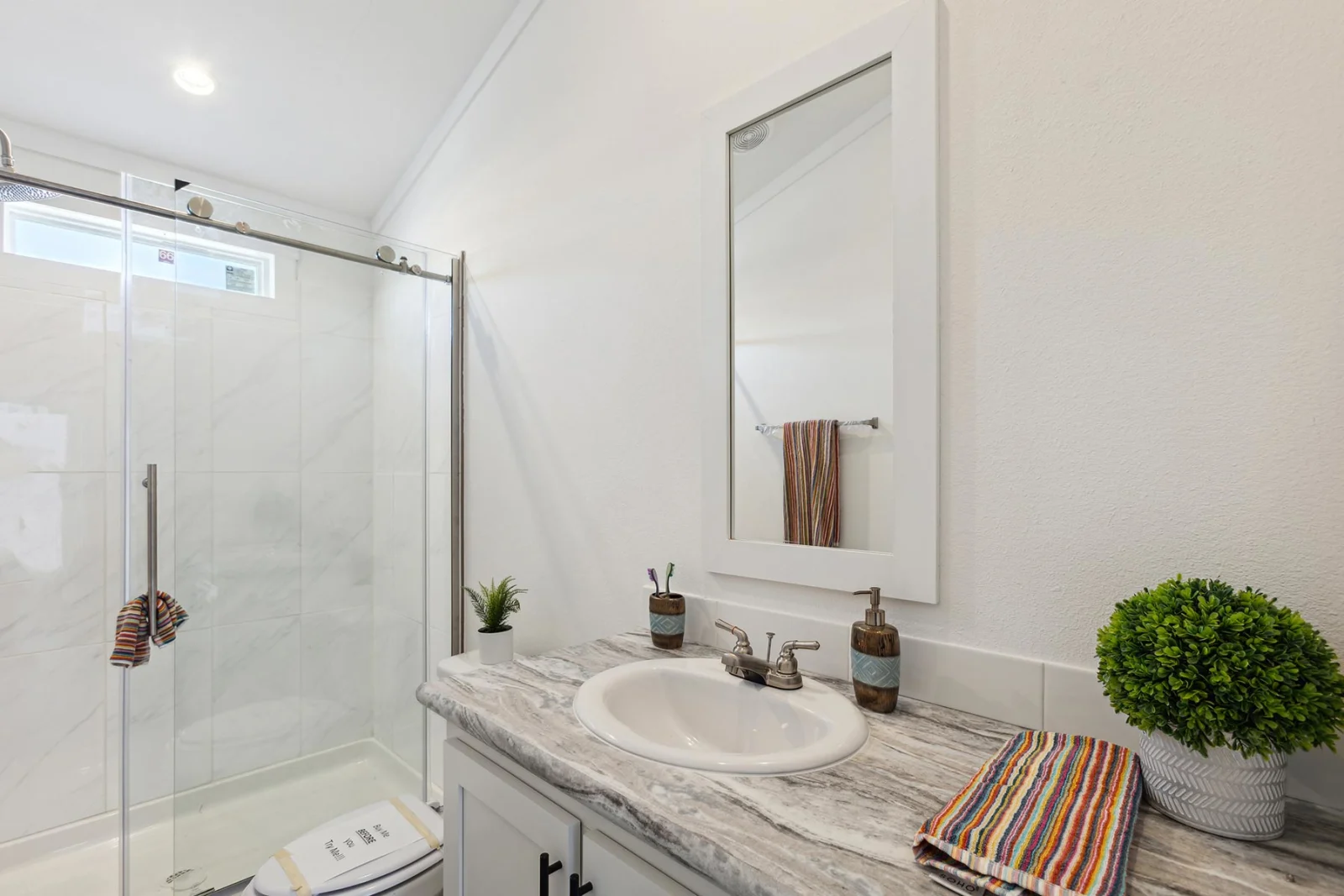 Bathroom of The Mini Mansion tiny home by Tiny Homes USA