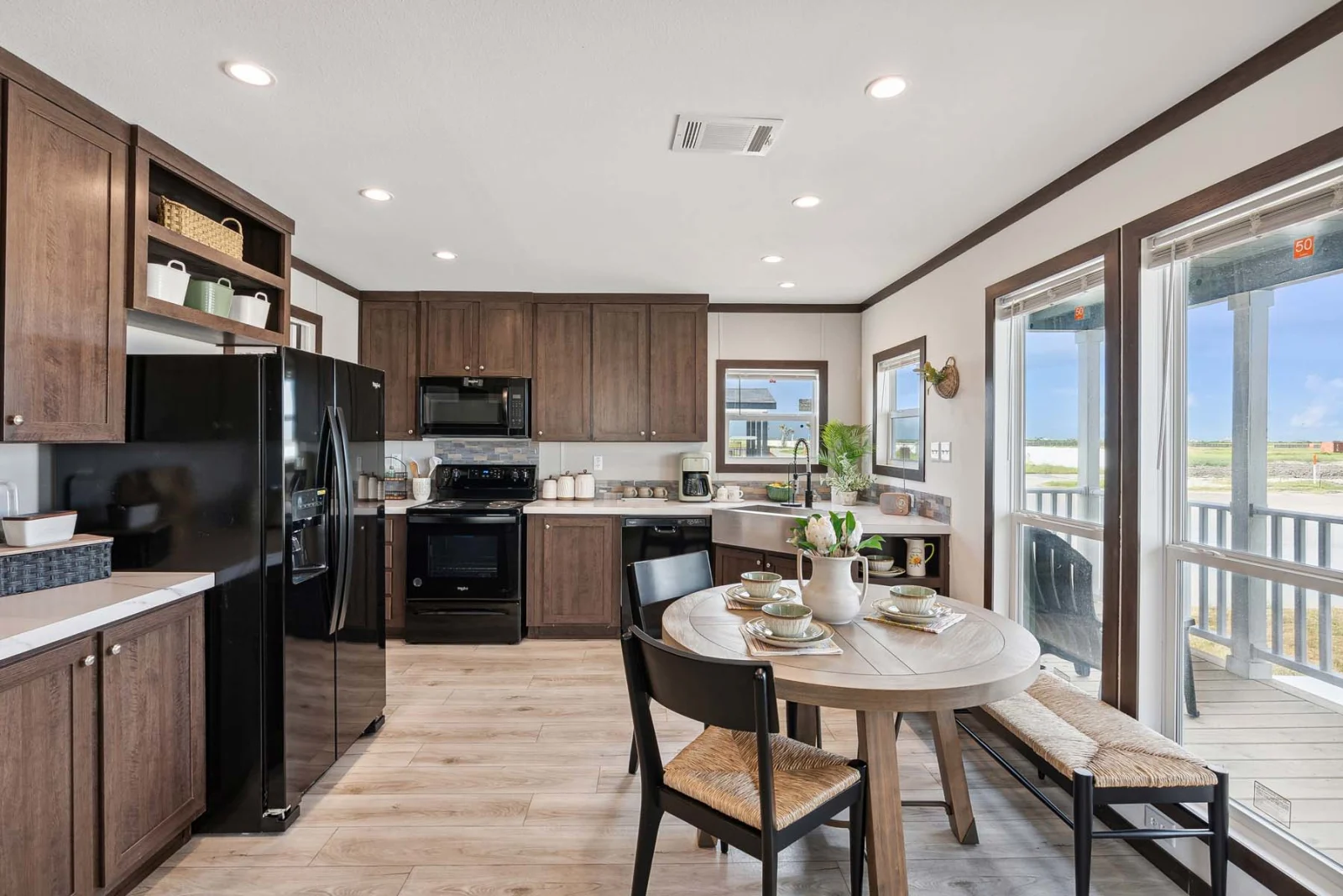 Open concept kitchen and dining area in The Rado tiny home