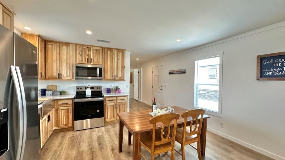Kitchen island view of the open concept living area in The Stealth manufactured home.